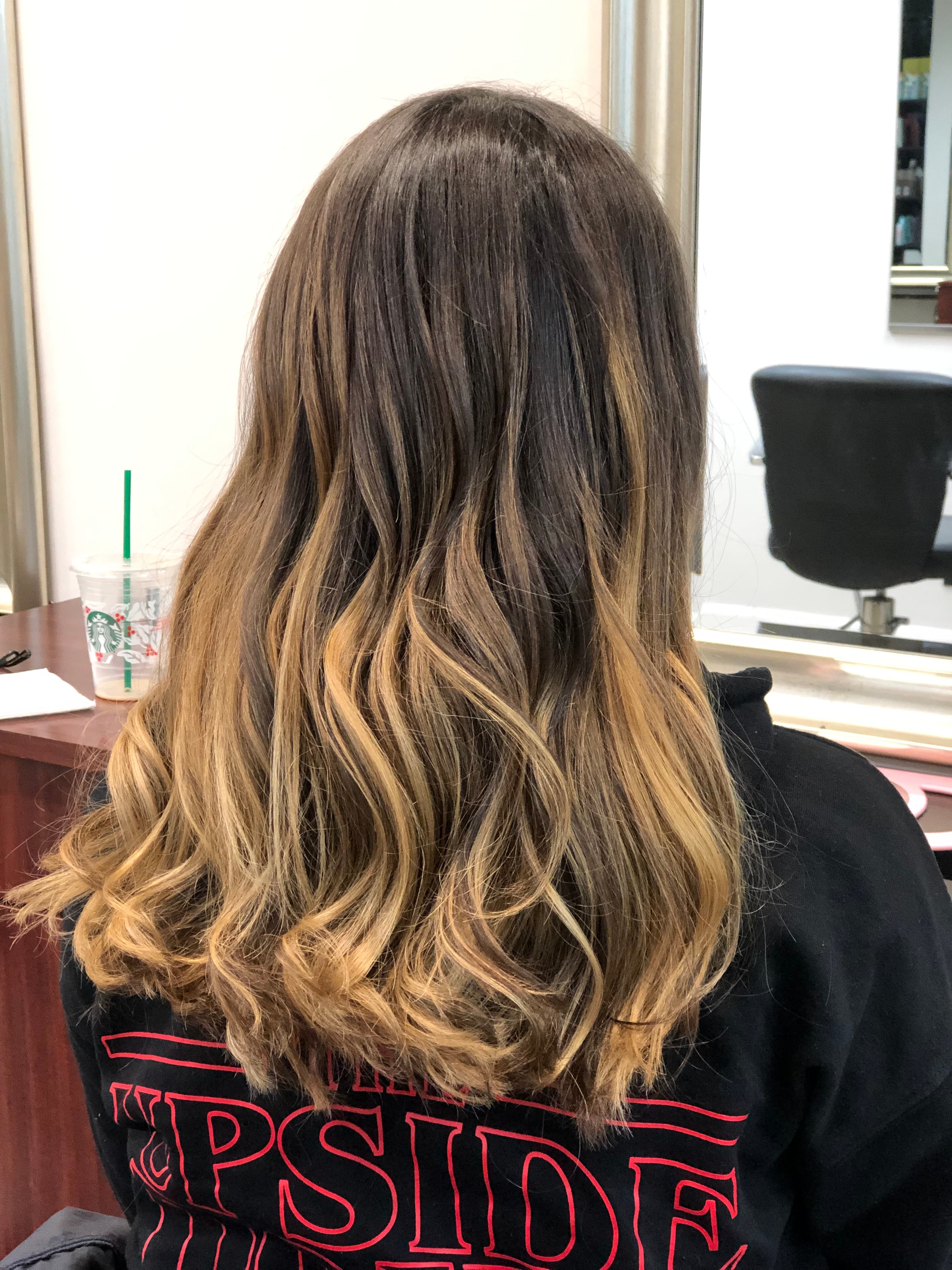 A modern, stylish haircut with clean lines and expertly crafted layers, showcasing a fresh and contemporary look.