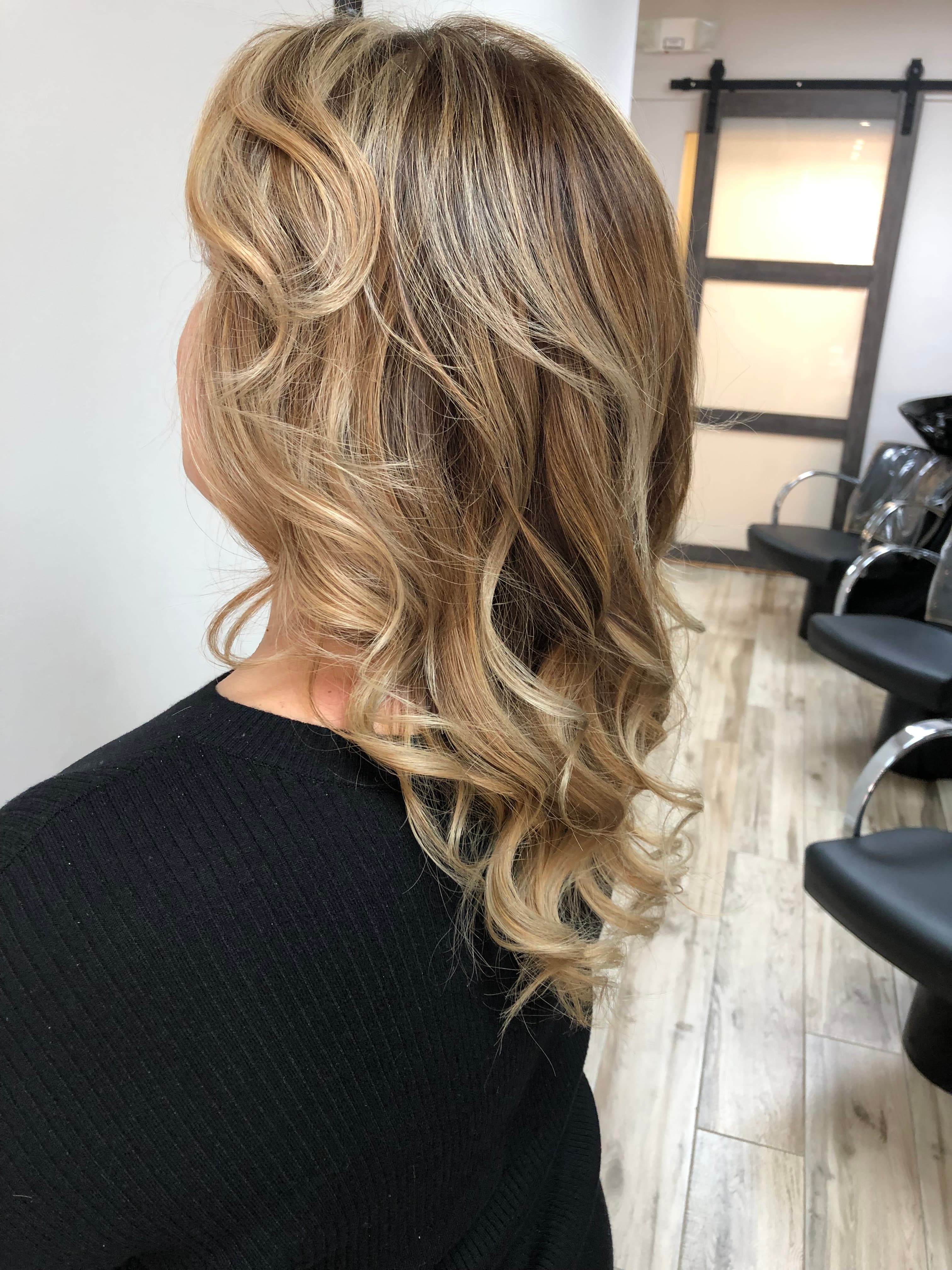 A modern, stylish haircut with clean lines and expertly crafted layers, showcasing a fresh and contemporary look.
