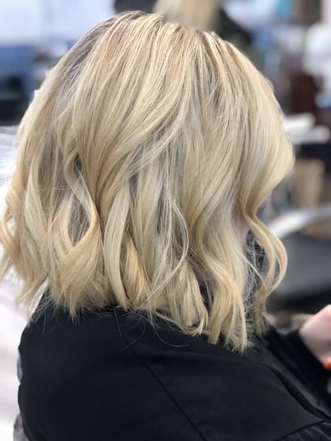 A modern, stylish haircut with clean lines and expertly crafted layers, showcasing a fresh and contemporary look.