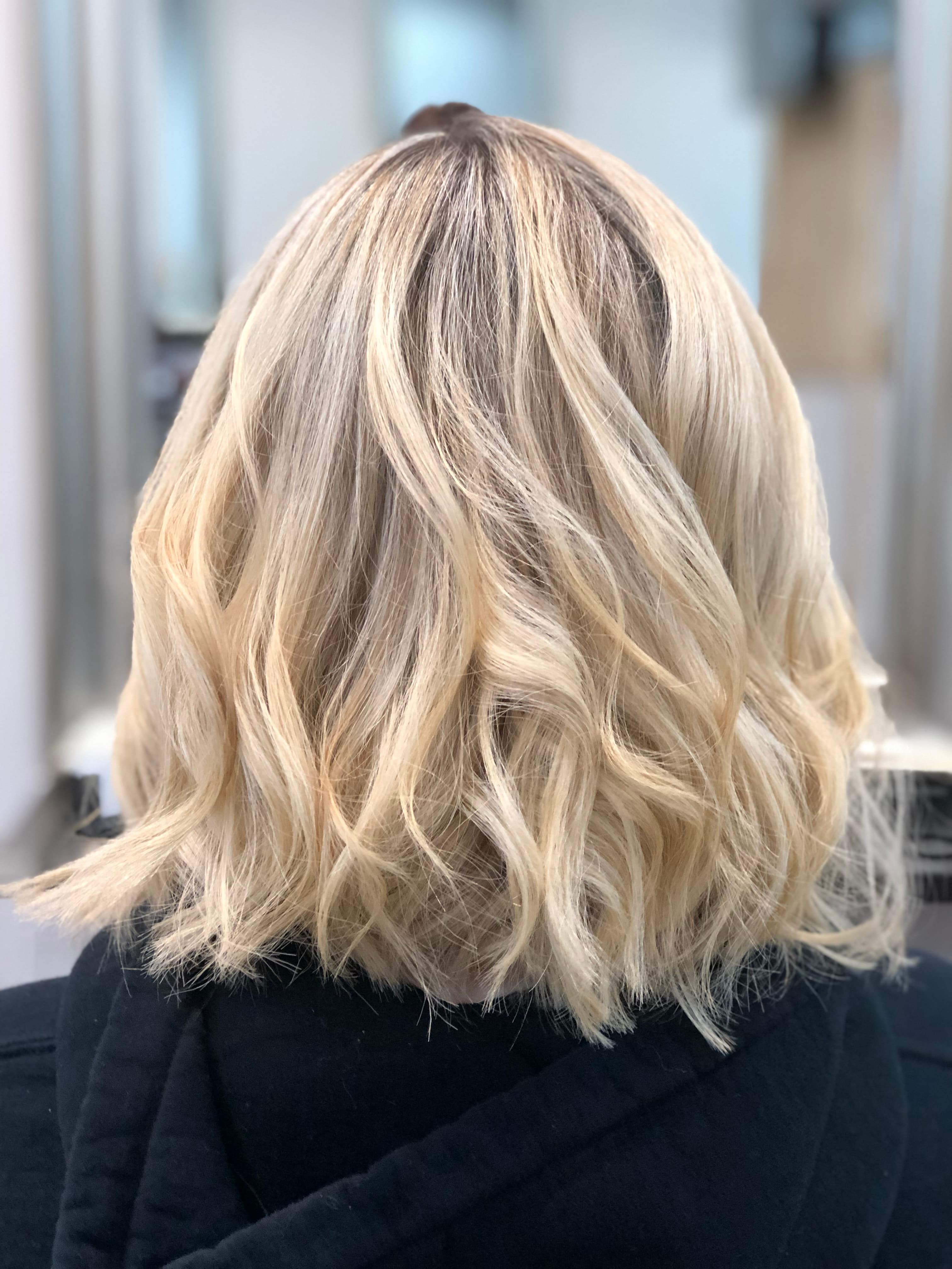 A modern, stylish haircut with clean lines and expertly crafted layers, showcasing a fresh and contemporary look.